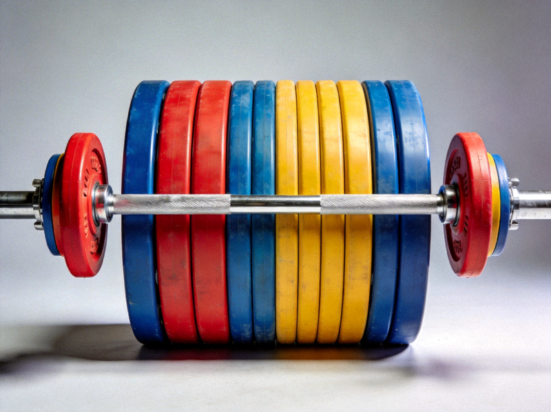 专业奥林匹克标准杠铃杆与彩色杠铃片组合